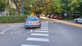 ROMANIA, BRASOV Ã¢â¬â SEPT 20, 2019. Driving instructor car parked blocking pedestrian crossing. Royalty Free Stock Photo